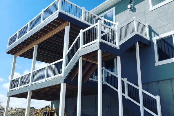 two decks with railing and stairs