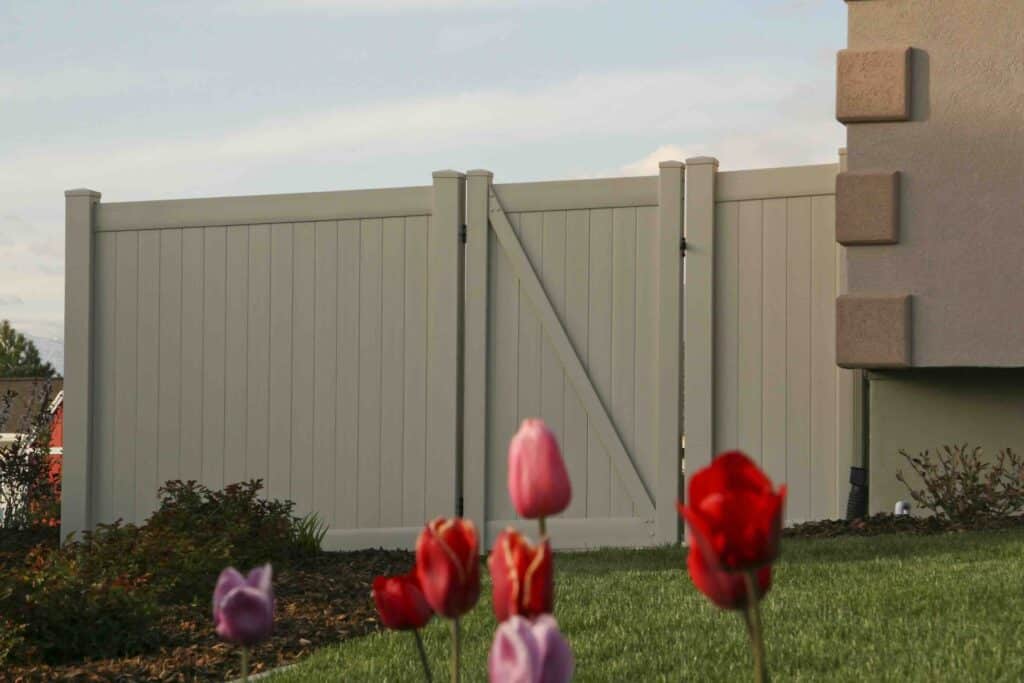 tan colored vinyl fence by best vinyl. 