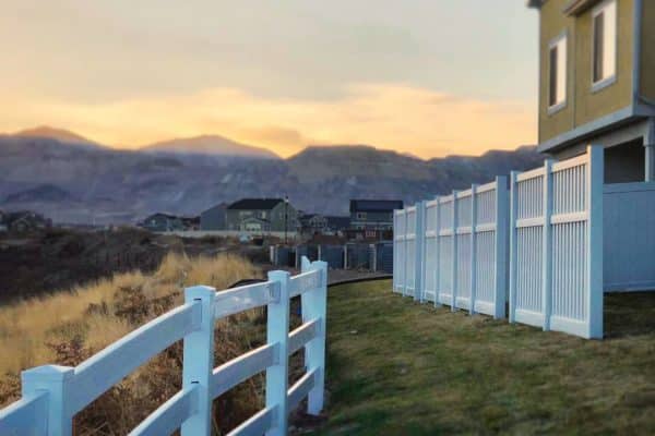 ranch rail fence near rocky mountains