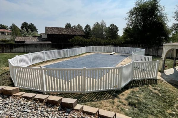 closed picket fence by pool